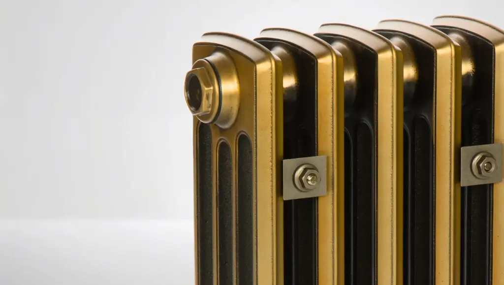 Antique brass finish cast iron column radiator, restored by Radrestore