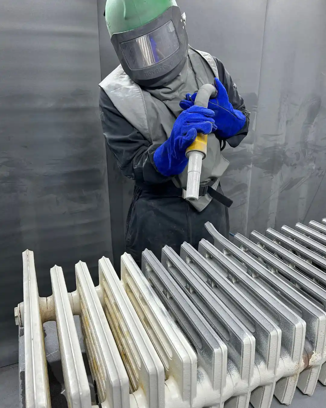 Cast iron radiator being blasted back to bare iron in the Radrestore workshop