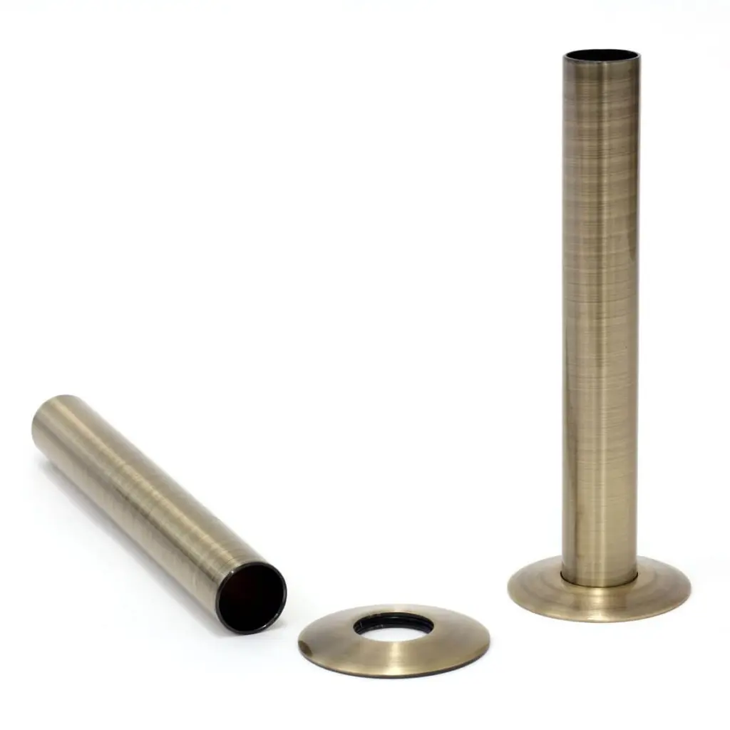 Cast iron radiator pipe kit in antique brass — pipe sleeves and base plates